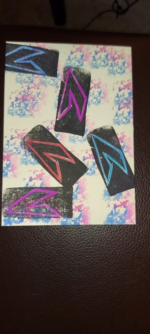 Printmaking card with black rectangles overlaid with colorful outlined zigzag shapes